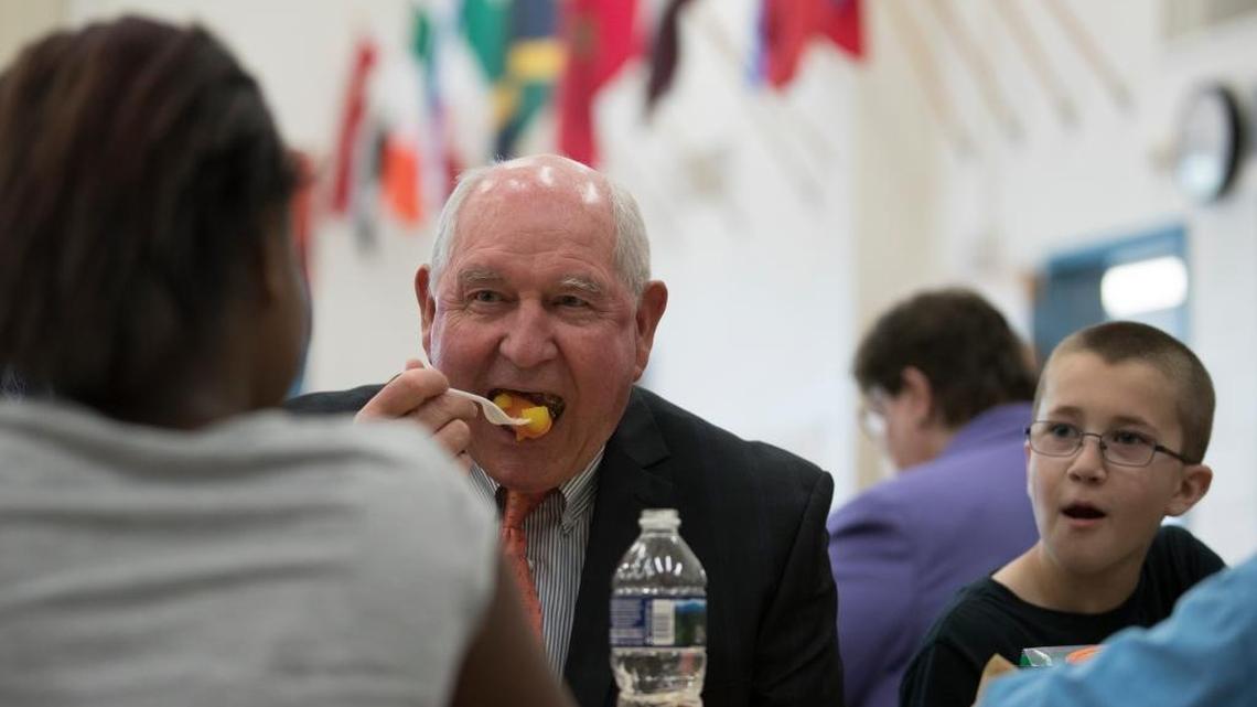 Agriculture Secretary Sonny Perdue eats lunch Monday with students at Catoctin Elementary School in Leesburg, Va., where he announced a partial rollback of Obama administration nutrition rules for school lunches.