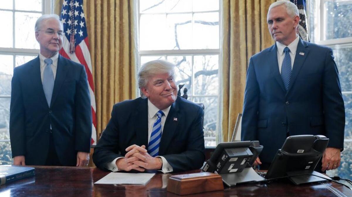 President Donald Trump, flanked by Health and Human Services Secretary Tom Price, left, and Vice President Mike Pence, right, addresses reporters on the failure to repeal Obamacare.