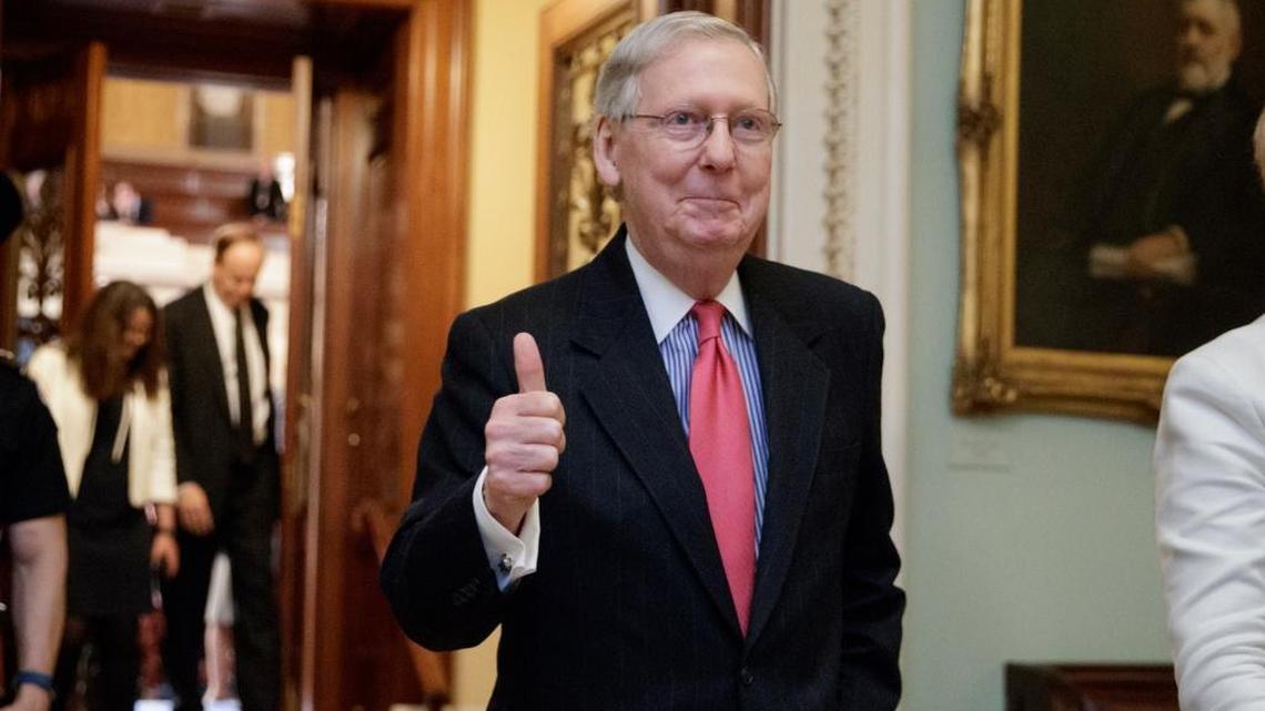 Senate Majority Leader Mitch McConnell gives a thumbs-up after Republicans voted Thursday to lower the vote threshold for Supreme Court nominees from 60 votes to a simple majority to advance Neil Gorsuch to a confirmation vote.