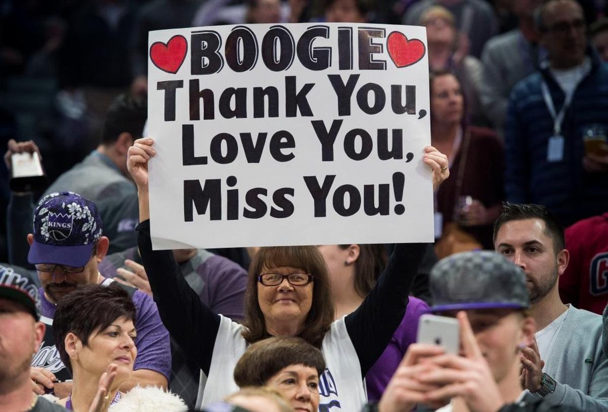 Kings fan Barbara Rust holds a sign in honor of DeMarcus Cousins after he was traded to New Orleans in February 2017.