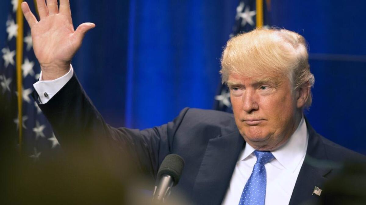 Republican presidential candidate Donald Trump waves to supporters after giving a speech at Saint Anselm College in New Hampshire on Monday.