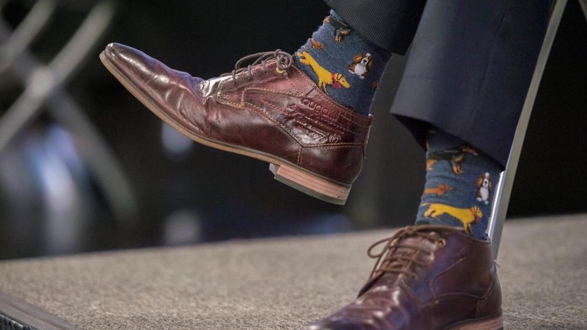 Los Angeles Mayor Eric Garcetti wears a pair of socks with dogs on them during his Q&A at the Sacramento Press Club in Sacramento on Tuesday.