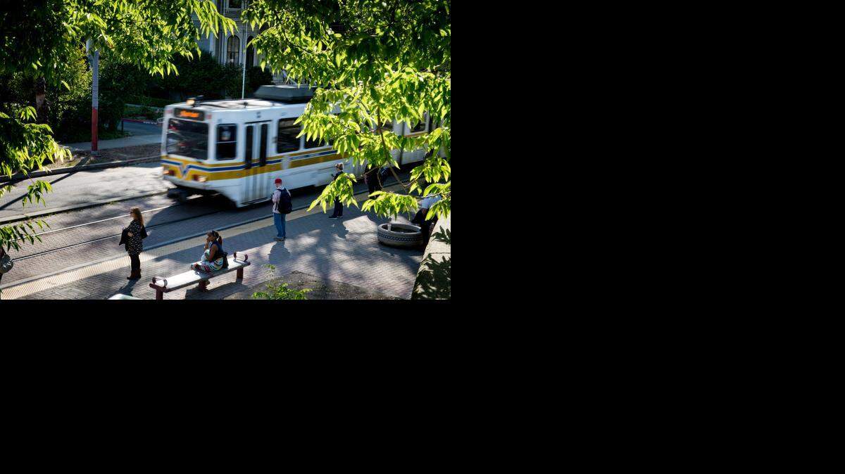 
Riders board a Regional Transit light-rail train at the station at Eighth and O streets last year. 
