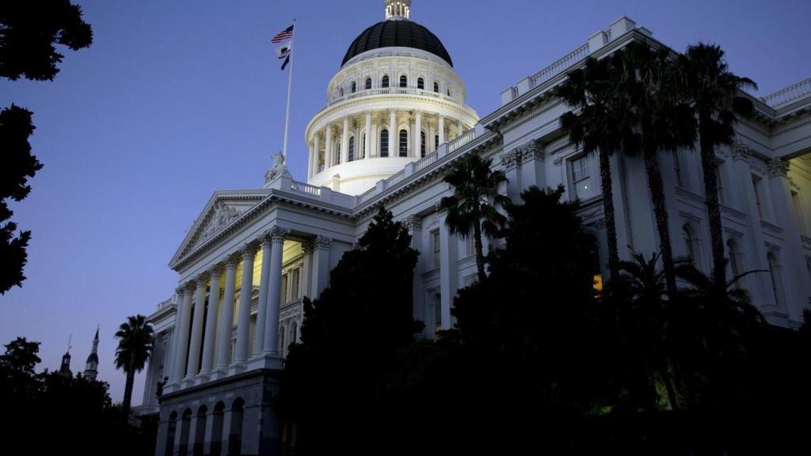 The dome of the Capitol glows in the early evening in Sacramento, Calif.
