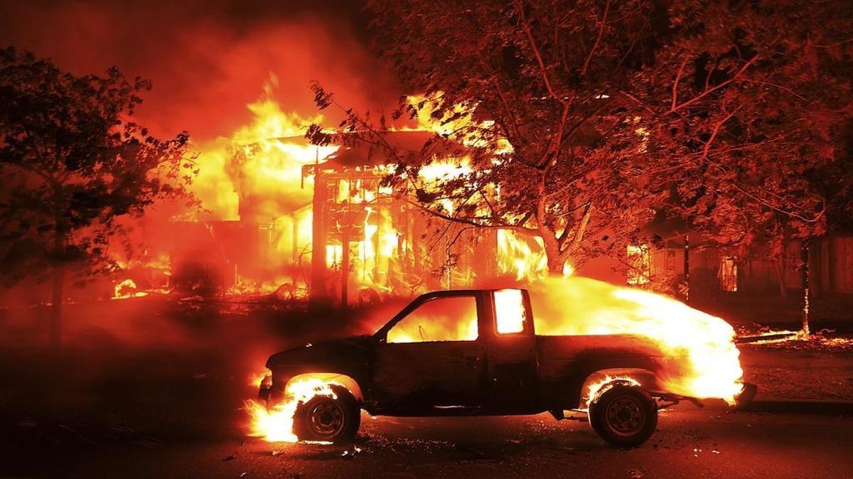 Homes burn in Santa Rosa on Oct. 9, 2017. The wine country fires, along with other blazes in Northern California, killed 44 people and produced $9.5 billion in insurance claims.