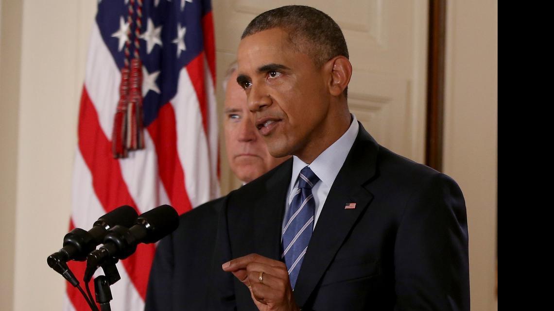 
President Barack Obama, standing with Vice President Joe Biden, vowed to veto any bill to scuttle an Iran nuclear deal during remarks Tuesday in the East Room of the White House. 
