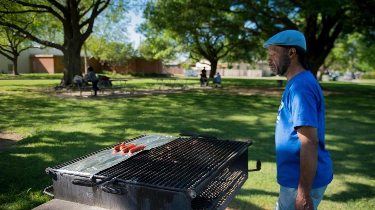 Allan Eaton, 62, of Sacramento uses a grill at Mangan Park. The picnic area is near the gun range, closed in December 2014 after tests showed it was contaminated with lead dust. The city didn’t test the picnic area until last week.