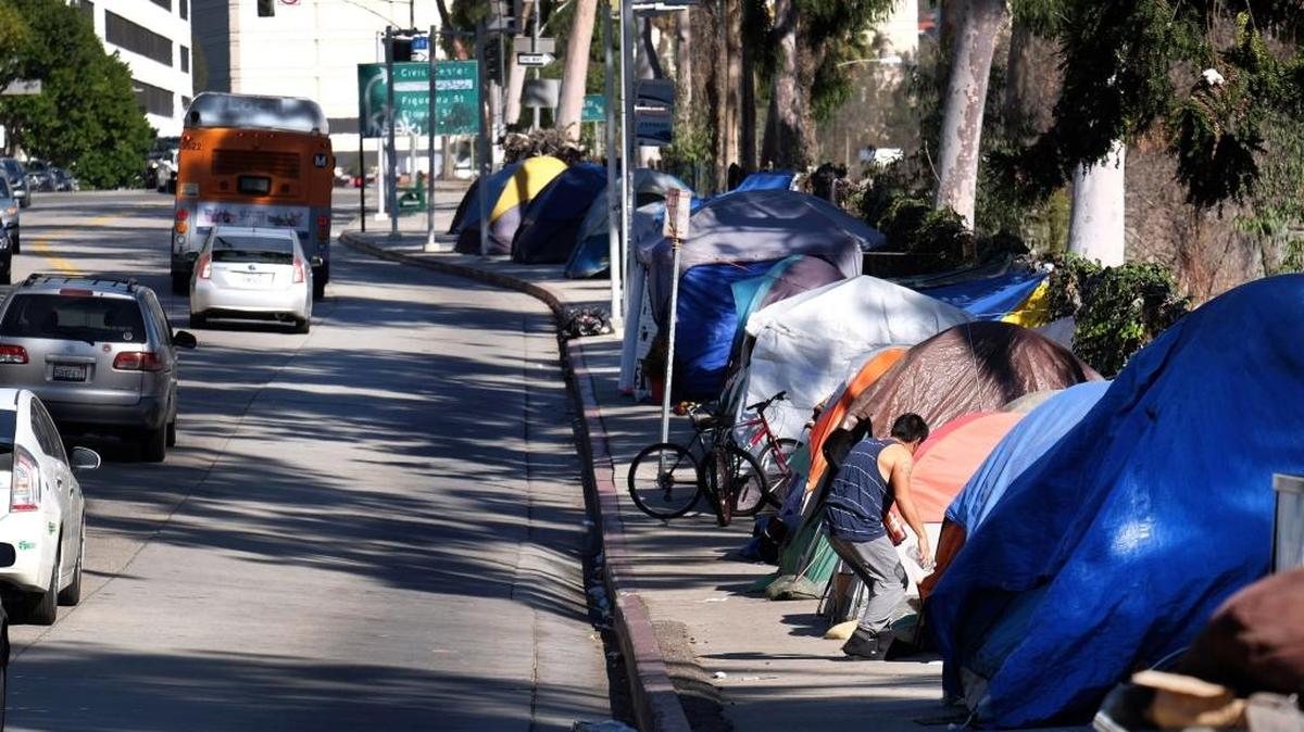 Tents from a homeless encampment line a street in downtown Los Angeles in January. The House has approved HR 2646, which would provide more care and treatment of severely mentally ill people, though it would not help them find housing.
