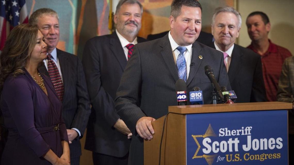 Sacramento County Sheriff Scott Jones, center, who is running for Congress, has overseen a twentyfold increase in concealed weapons permits during his tenure in Sacramento County’s top law enforcement job.