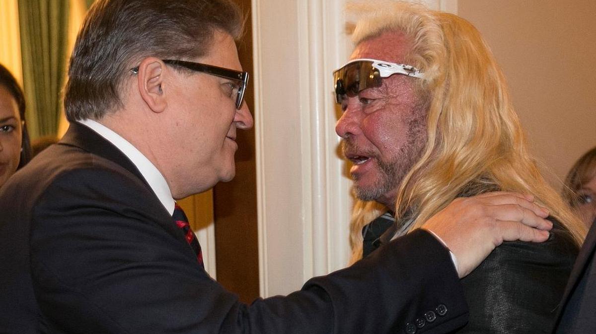 Sen. Robert Hertzberg, left, talks with reality show star Duane “Dog the Bounty Hunter” Chapman after he testified against Hertzberg's bail reform bill in April. On Friday, Gov. Jerry Brown announced that the bill won’t move this year.