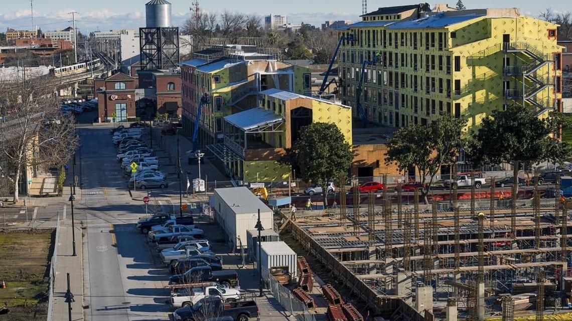 Two modern glass-and-metal structures in the foreground will rise on the ground formerly occupied by the Crystal Ice and Cold Storage building and is part of the Ice Blocks project on R street between 18th and 16th streets.