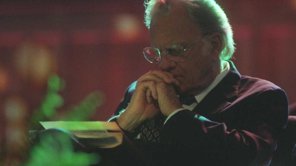 Billy Graham sits in reflection moments before addressing an overflow crowd at Arco Arena on Oct. 22, 1995, during his last crusade in Sacramento.
