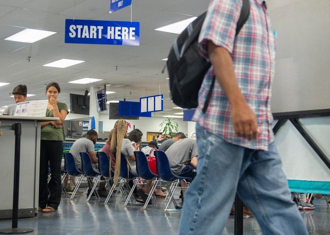 Customers wait for their number to be called at a Department of Motor Vehicles office in Sacramento on June 14.