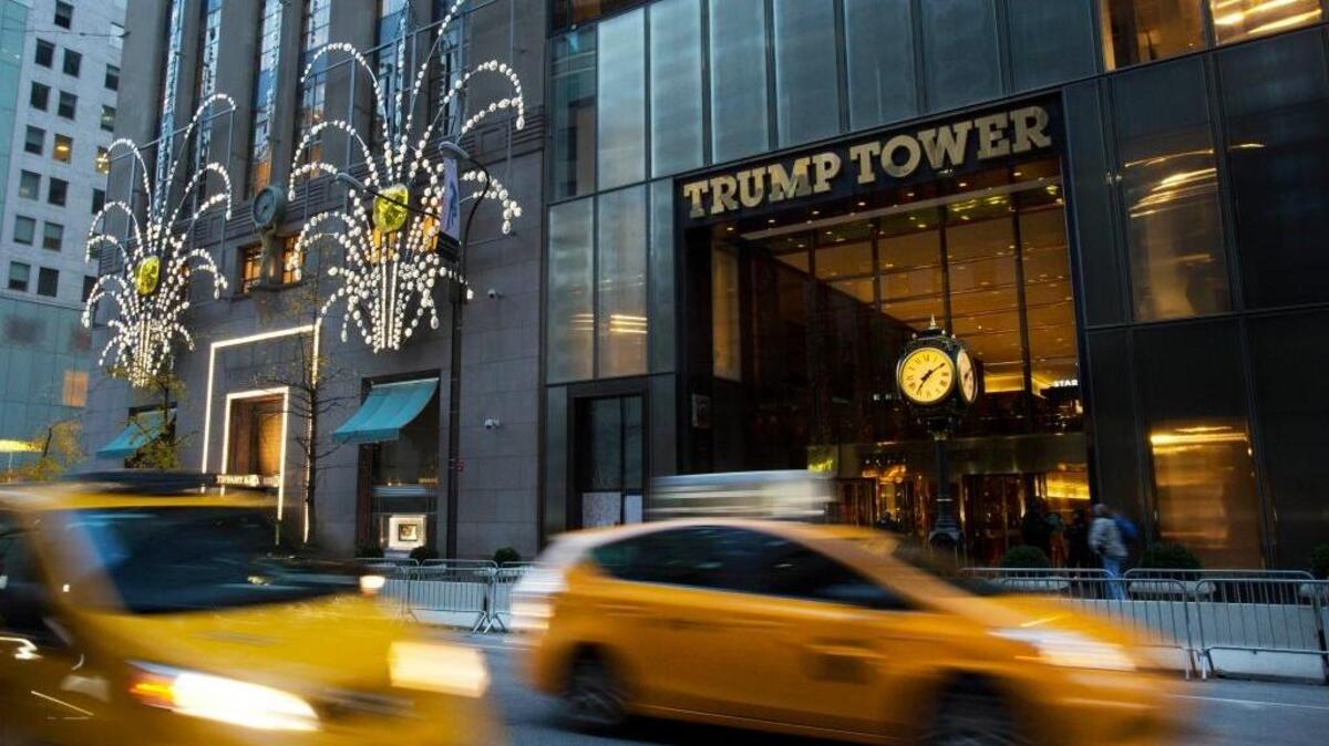 Traffic passes Trump Tower in New York on Nov. 21. Pressure is building on President-elect Donald Trump to do more to head off conflicts of interest between his business holdings and his decisions as president.