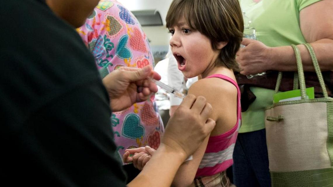 Daniel Arroyo of Elk Grove gets a flu shot during a Kaiser Permanente community flu vaccine last year in Sacramento. Kaiser’s new medical school will broaden physician diversity and teach the health system’s tenets, including an emphasis on preventive health care.