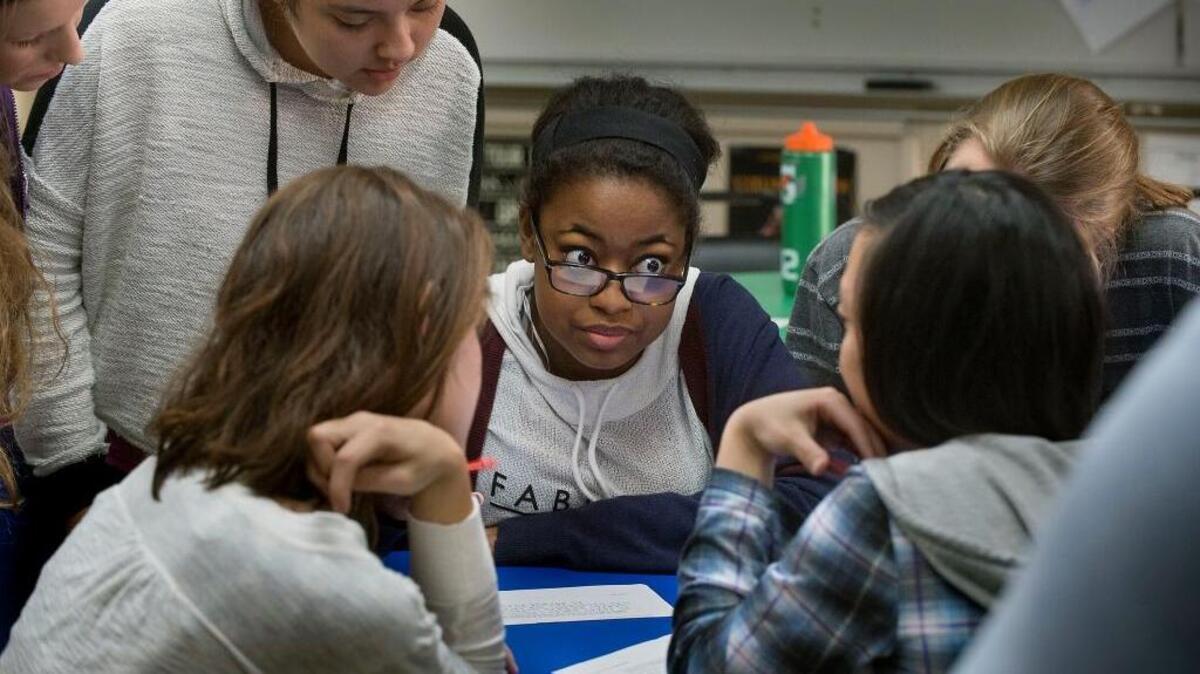 Students including Imani Smith, center, work on a Common Core assignment involving chemistry, language and other subjects in February at Bella Vista High School in Fair Oaks. The first year-to-year Common Core test results landed this week.