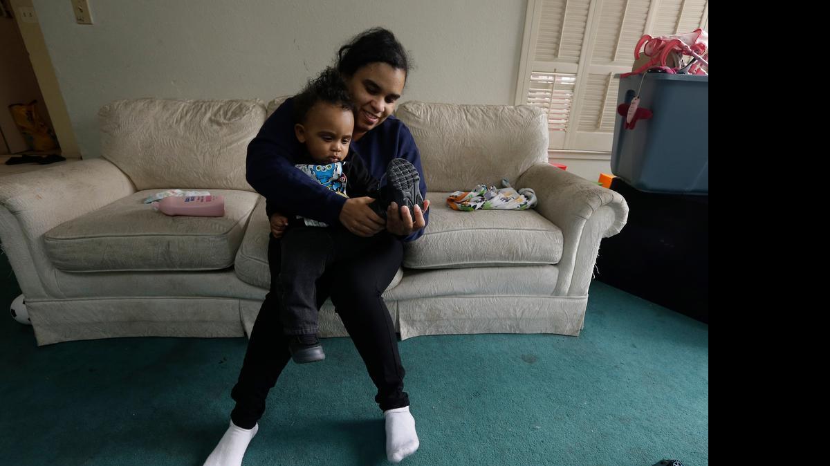 
Shannon Henderson dresses her year-old son Justin,before leaving for her job as a part-time customer service representative at a Walmart in Sacramento. Starting Wednesday, she and millions of other California workers are guaranteed paid sick leave. 
