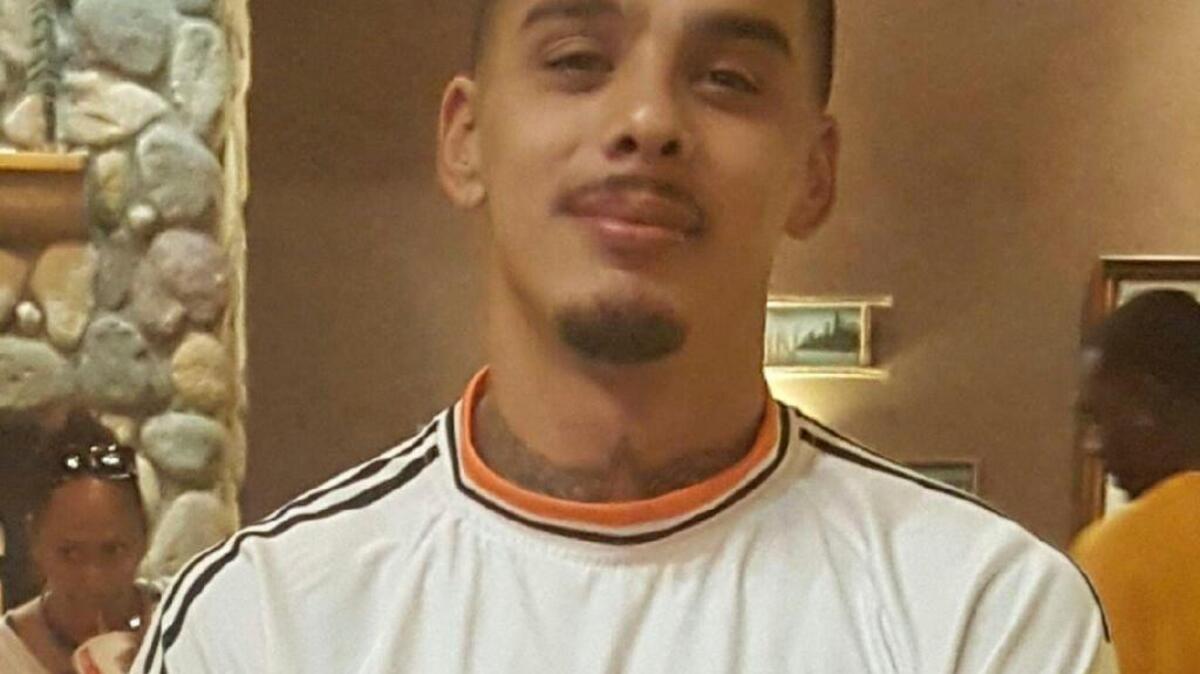 Abraham Garza, 26, died after suffering a head injury while working as a spotter to ensure that bins aligned with a trash compactor, authorities said.