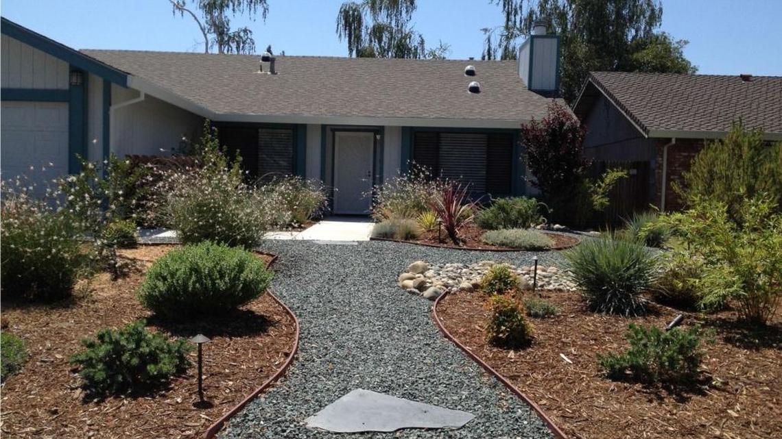 After a water-wise makeover, a Sacramento home features drought-tolerant plants and uses half the water of a typical house its size.