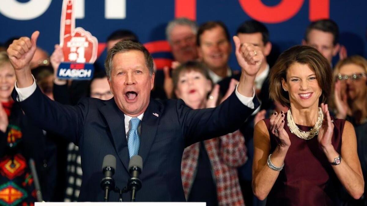 Gov. John Kasich of Ohio celebrates with supporters Tuesday night after finishing a strong second in the New Hampshire primary.