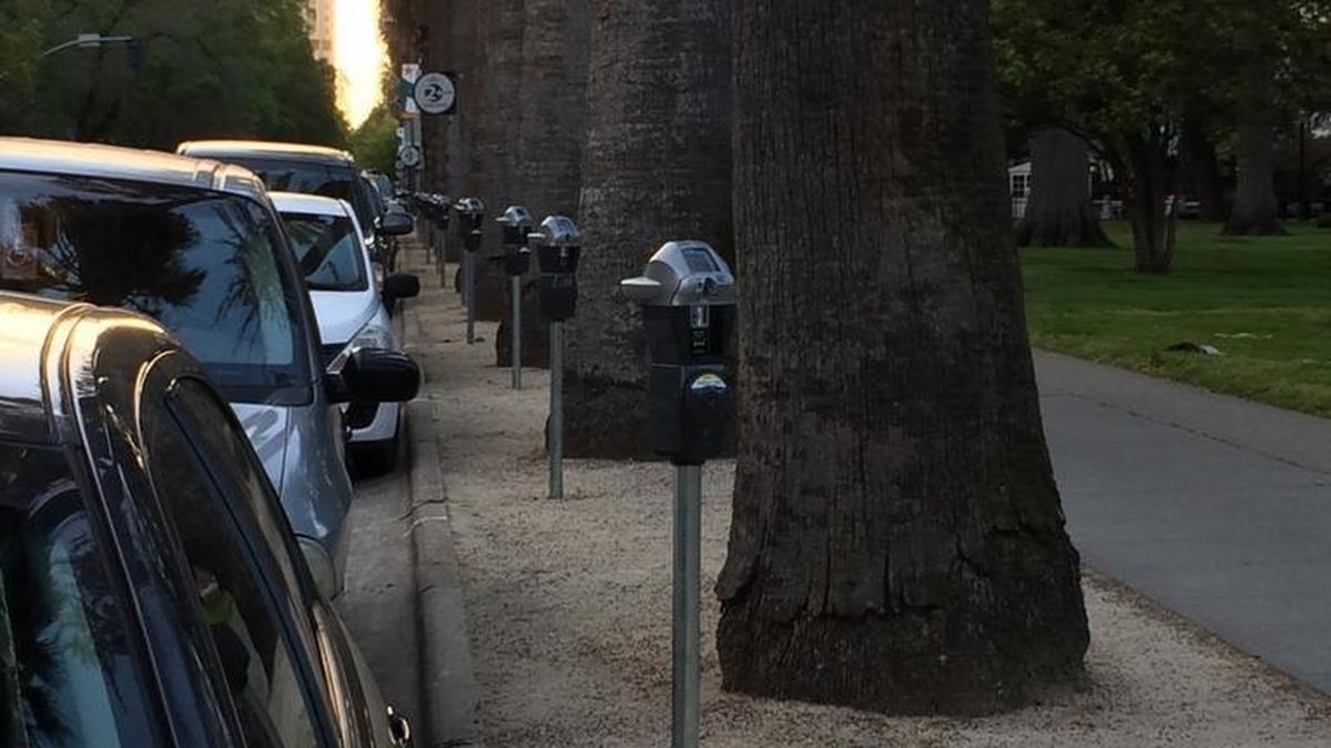 Smart parking meters line N Street near the state Capitol. Sacramento’s city auditor is investigating a spike in the number of erroneous tickets for expired meters.