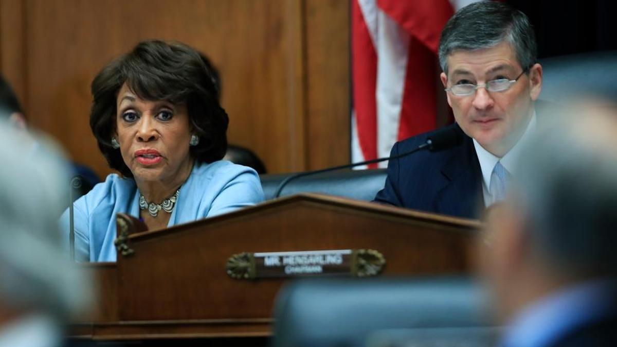 Rep. Maxine Waters D-Los Angeles, sits with with Rep. Jeb Hensarling, of Texas on Capitol Hill in Washington.