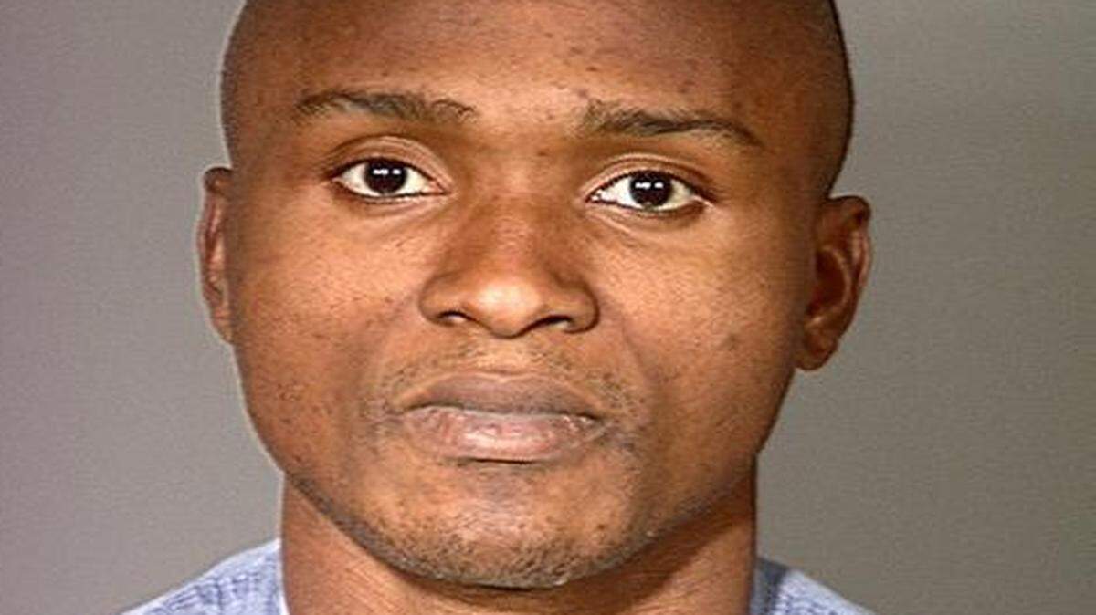 
This February 2000 photo shows Charley Saturmin Robinet after his arrest for robbery. Robinet was killed Sunday on Los Angeles’ skid row. 
