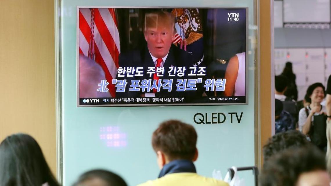 Commuters at a train station in Seoul, South Korea, watch a news program on Wednesday about President Donald Trump’s threat against North Korea of “fire and fury like the world has never seen.”