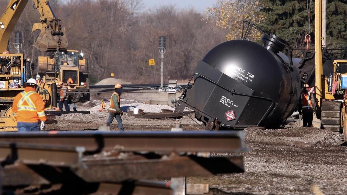 Workers tend to the scene of a oil train derailment in Watertown, Wis., last Nov. 9. Communities across California and the country are concerned about the safety of trains carrying oil.