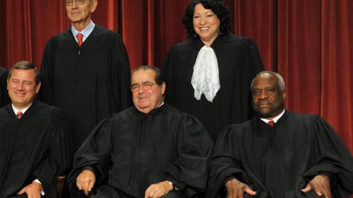 Justice Antonin Scalia, front center, died Saturday, Feb. 13, 2016, at 79.