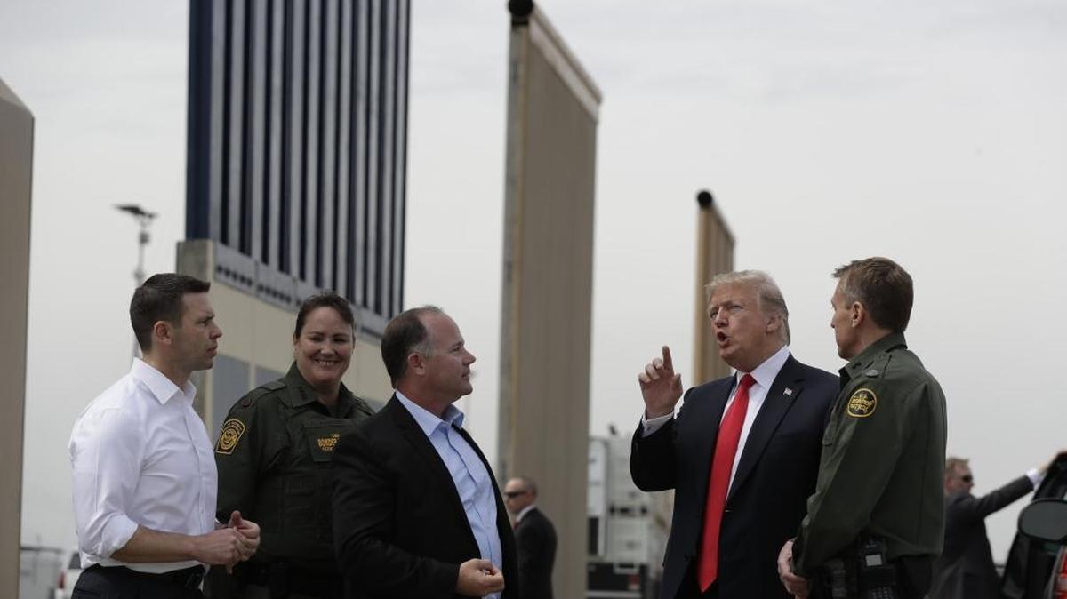President Donald Trump reviews border wall prototypes on Tuesday in San Diego.
