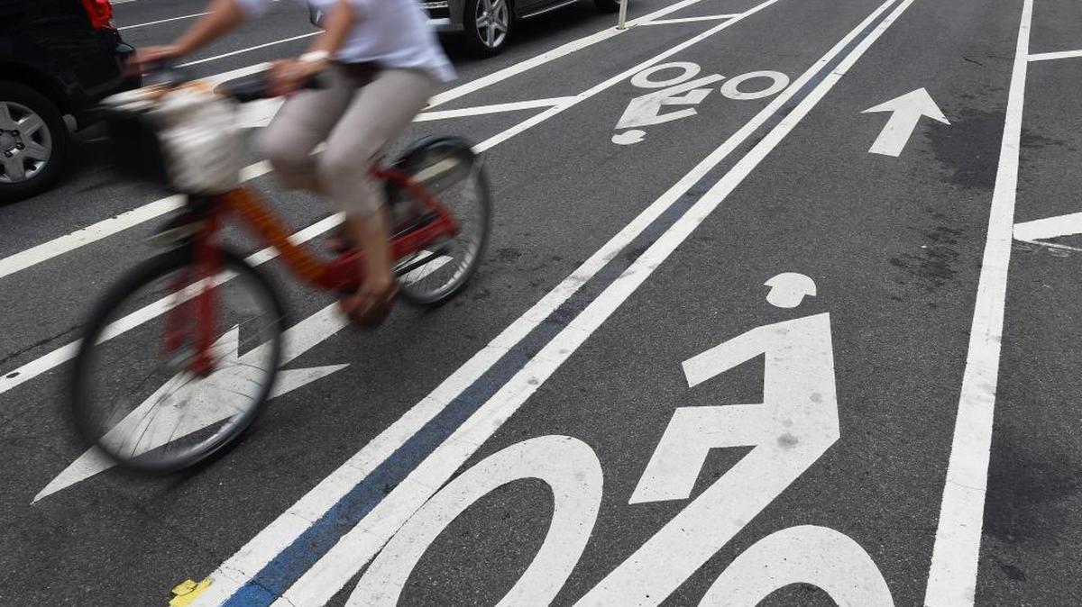 A bicyclist rides in a bike lane in Washington, D.C. There’s discussion of building such “cycle tracks” in Sacramento.