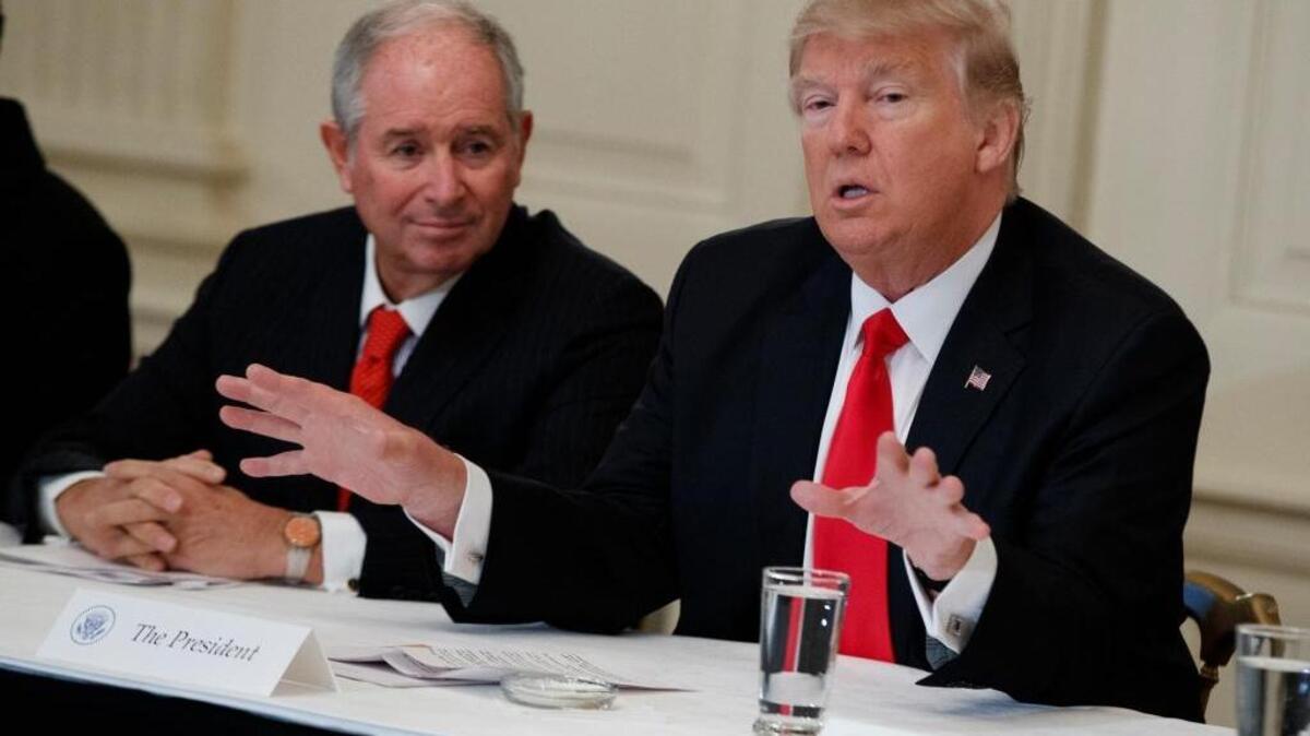 President Donald Trump meets with business leaders Friday before signing an executive directive to review the Dodd-Frank law, enacted after the 2008 financial crash.