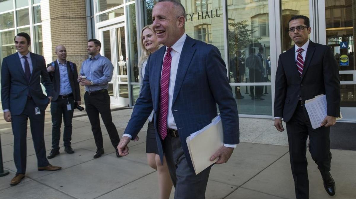 Sacramento Mayor Darrell Steinberg, center, is all smiles as he heads to a press conference on Nov. 6 to announce there will be no teachers’ strike.
