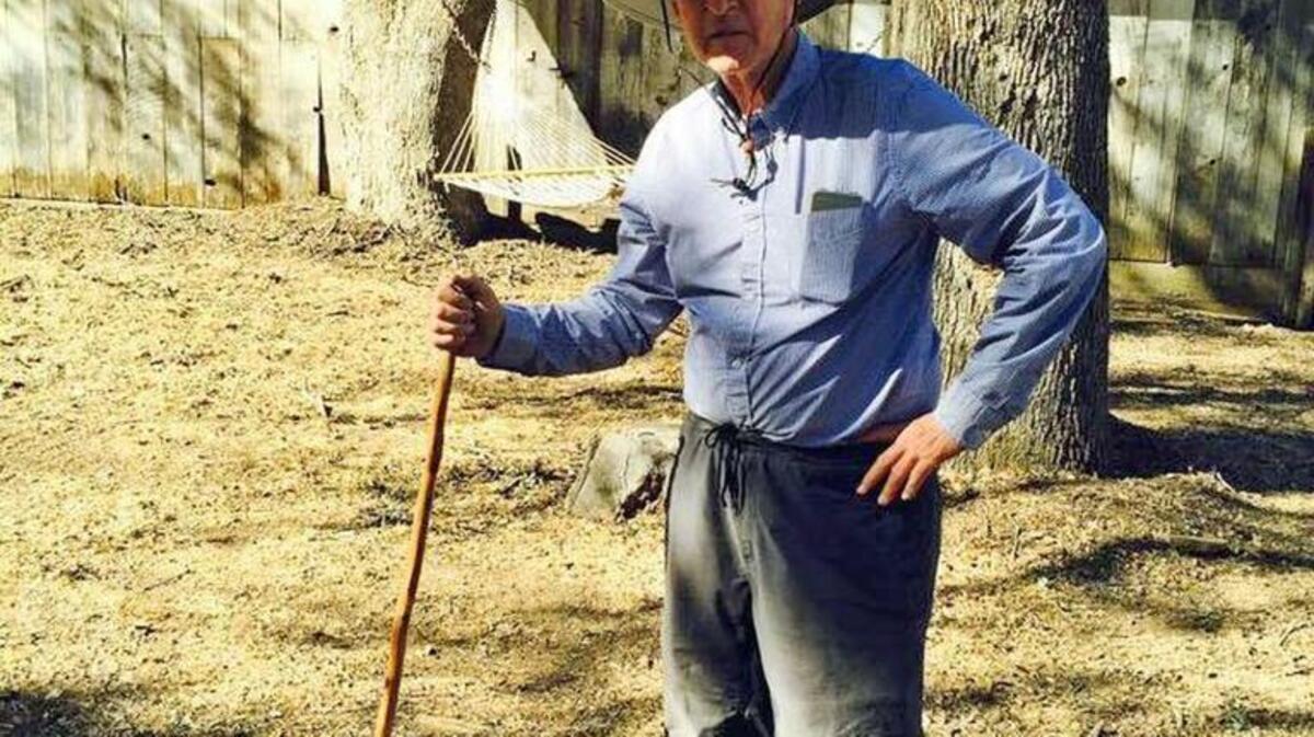 Gov. Jerry Brown poses with a rattlesnake at Brown’s family ranch in Colusa County.