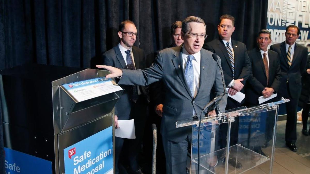 Richard Ashworth, president for pharmacy and retail operations for Walgreens, listens at left, as Sen. Mark Kirk, R-Ill. speaks during a news conference on Capitol Hill on Tuesday. The company plans to install safe medication disposal kiosks in more than 500 drugstores by the end of the year.