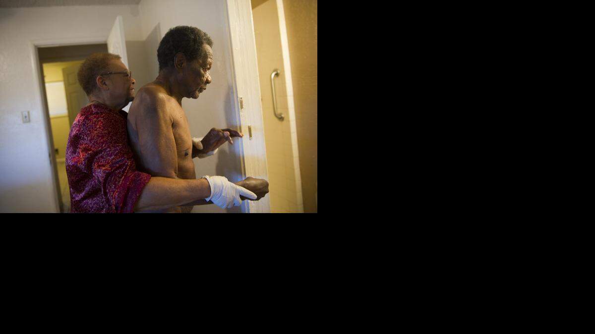 
Juanita Turner prepares to bathe her 80-year-old husband, who is in the late stages of Alzheimer’s. The disease’s toll is rising, but Congress continues to underfund research.
