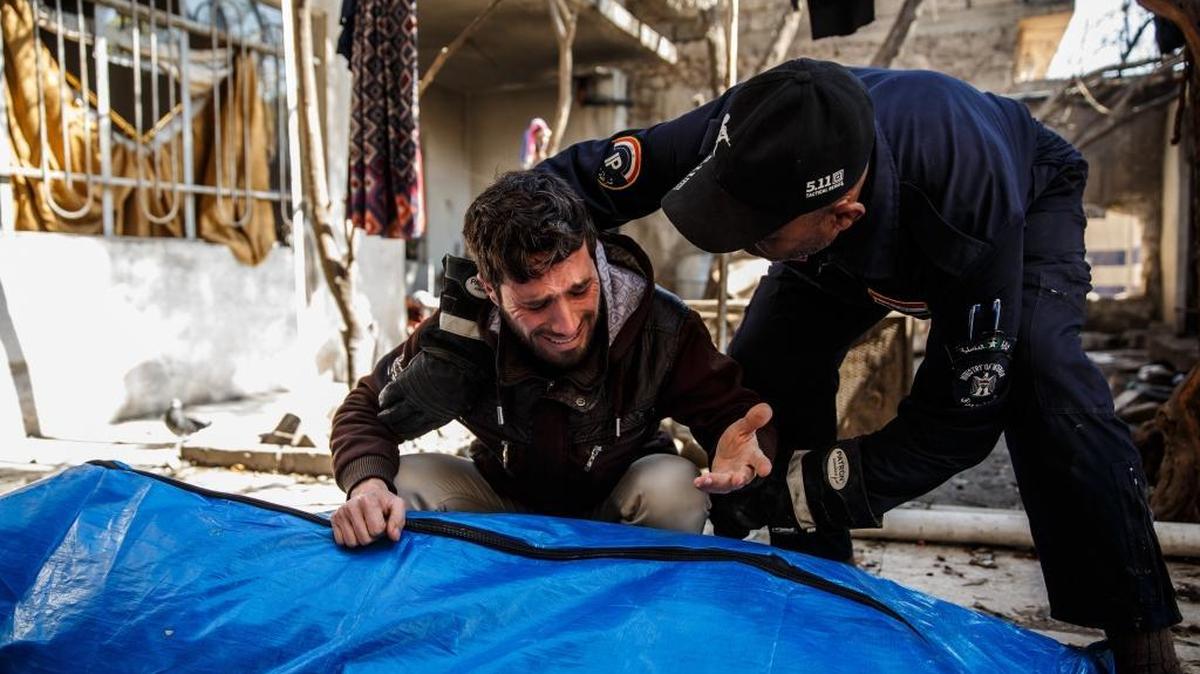 A man grieves for relatives found dead in the rubble after a U.S. airstrike in Mosul, Iraq, on March 17.