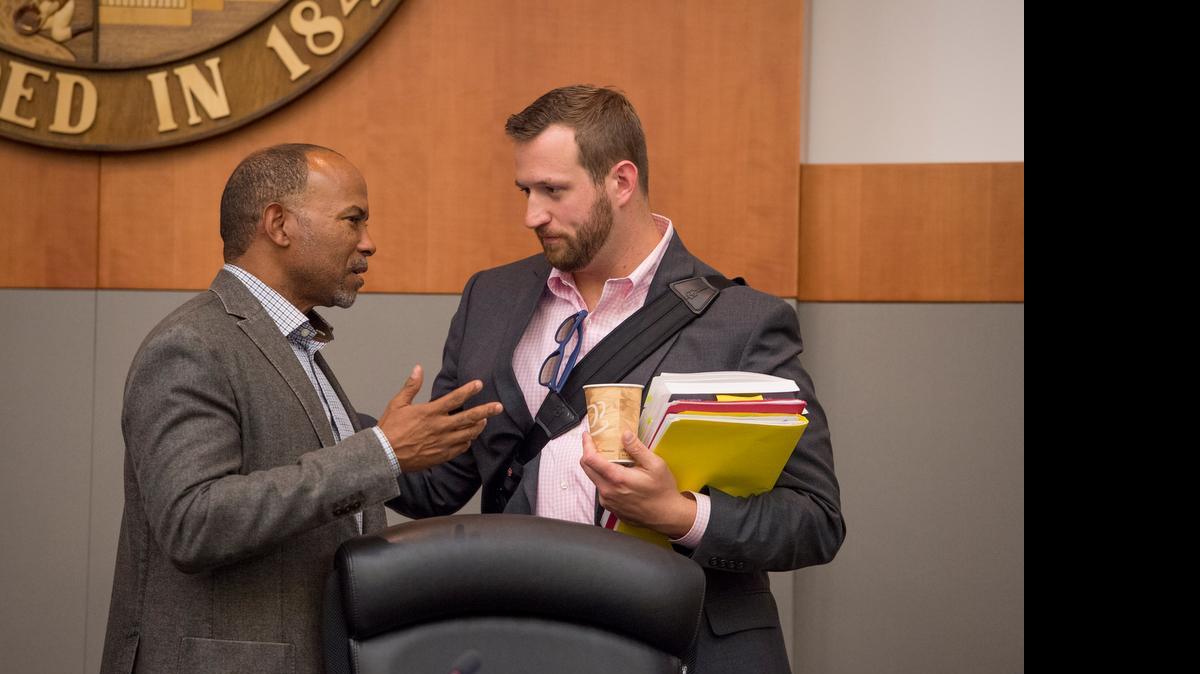 
Sacramento City Councilmen Allen Warren, left, and Steve Hansen talk after Tuesday’s council meeting, where there was a testy exchange over a budget increase for Mayor Kevin Johnson’s office. They also disagreed about an ad hoc committee meeting privately on “good governance” reforms.
