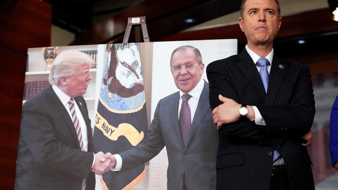 Rep. Adam Schiff of California, the top Democrat on the House Intelligence Committee, stands next to a photograph of President Donald Trump and Russian Foreign Minister Sergey Lavrov during a news conference on Capitol Hill on Wednesday.