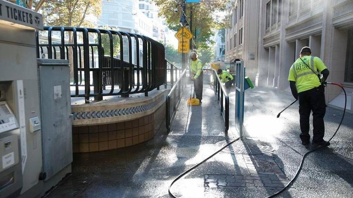 
A Downtown Sacramento Partnership crew power-washes a light-rail station at 11th and K streets. Cleaner stops with less graffiti may perk up ridership. 
