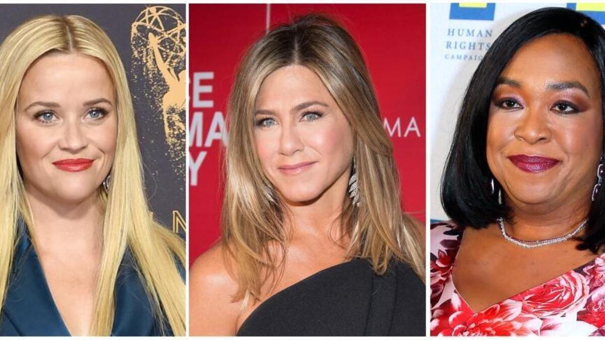 An anti-harassment initiative launched by, among others, Reese Witherspoon, Jennifer Aniston and Shonda Rhimes, from left, is expected to take center stage at the Golden Globes on Sunday in the aftermath of the Harvey Weinstein scandal. The group has explicitly stated its focus will include working-class women and not just those in the entertainment industry. (AP Photo/File)