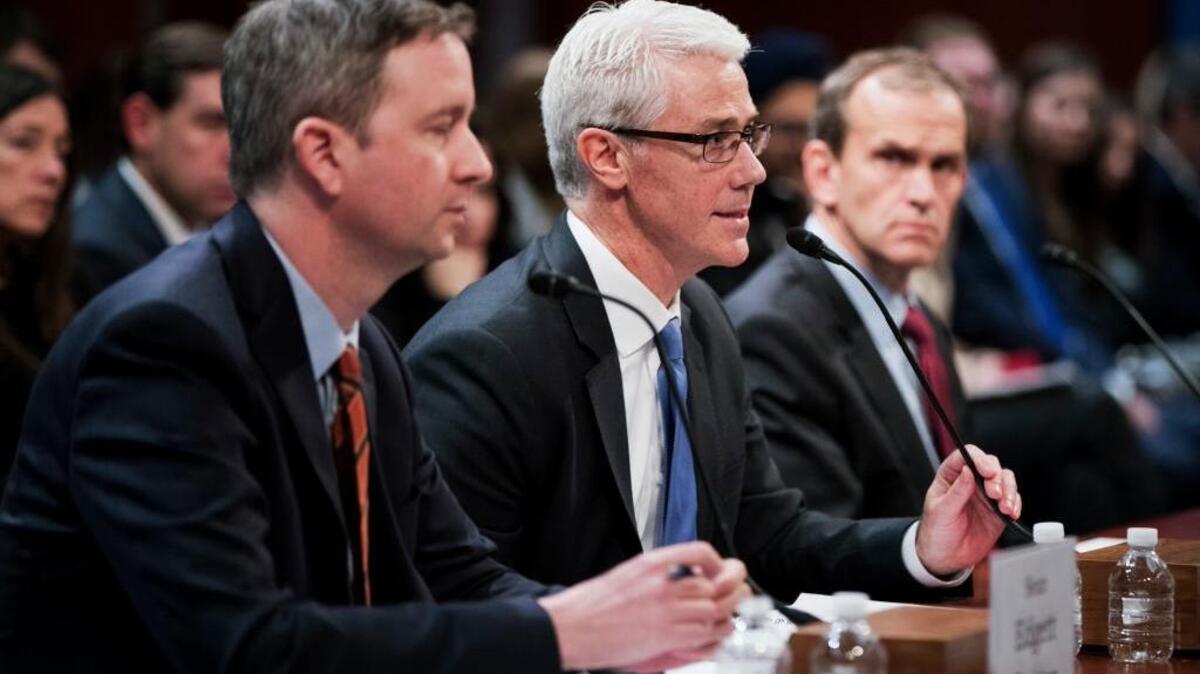 From left, Twitter's acting General Counsel Sean Edgett, Facebook's General Counsel Colin Stretch and Google’s General Counsel Kent Walker testify before a House Intelligence Committee hearing on Capitol Hill on Wednesday.