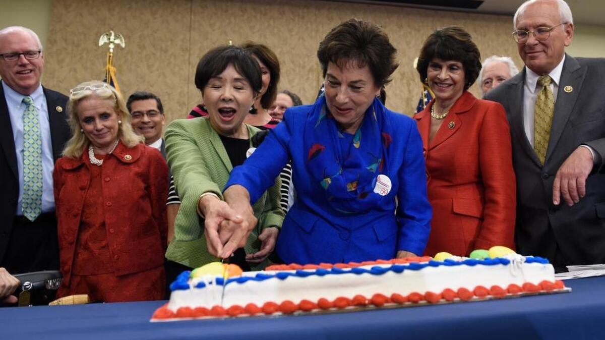 
Rep. Doris Matsui, D-Sacramento, in green, and other congressional Democrats cut a cake to celebrate the 50th anniversary of Medicare and Medicaid in Washington last week. 

