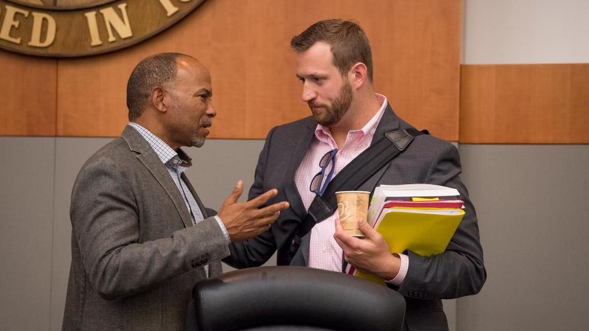 Sacramento City Councilmen Allen Warren and Steve Hansen talk after a testy budget hearing in May over increases in Mayor Kevin Johnson’s office.