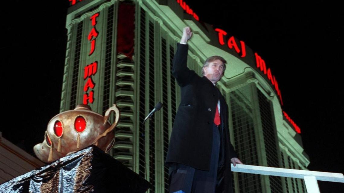Donald Trump celebrates at the opening of the Trump Taj Mahal Casino Resort in Atlantic City, N.J., in 1990. The New York Times reports that he used a tax loophole on debt from his casinos to potentially avoid millions in federal income taxes.