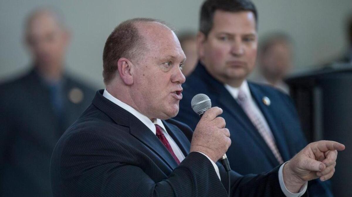 Sacramento Sheriff Scott Jones, right, and acting Immigration and Customs Enforcement Director Thomas Homan answer questions at a forum in Sacramento in March 2017. Jones is asking county supervisors to renew a contract with ICE to house detainees at a county jail in Elk Grove.