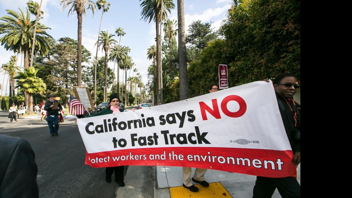 
Protesters took to the streets of Beverly Hills this month to demand that Hillary Rodham Clinton, in town for a fundraiser, oppose fast-track authority for President Barack Obama to finish negotiating the Trans-Pacific Partnership. 
