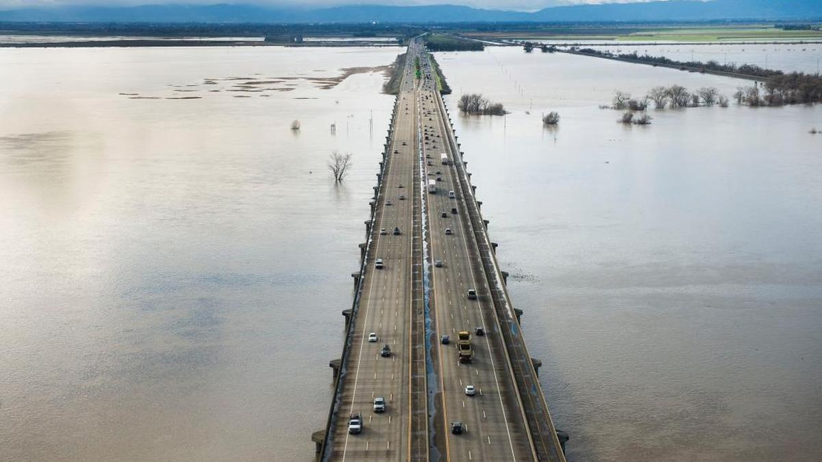 The Yolo Causeway, heading west toward Davis, is surrounded by water in the Yolo Bypass. Creating more such floodplains in the San Joaquin Valley might recharge drought-shriveled aquifers while allowing less reliance on dams.