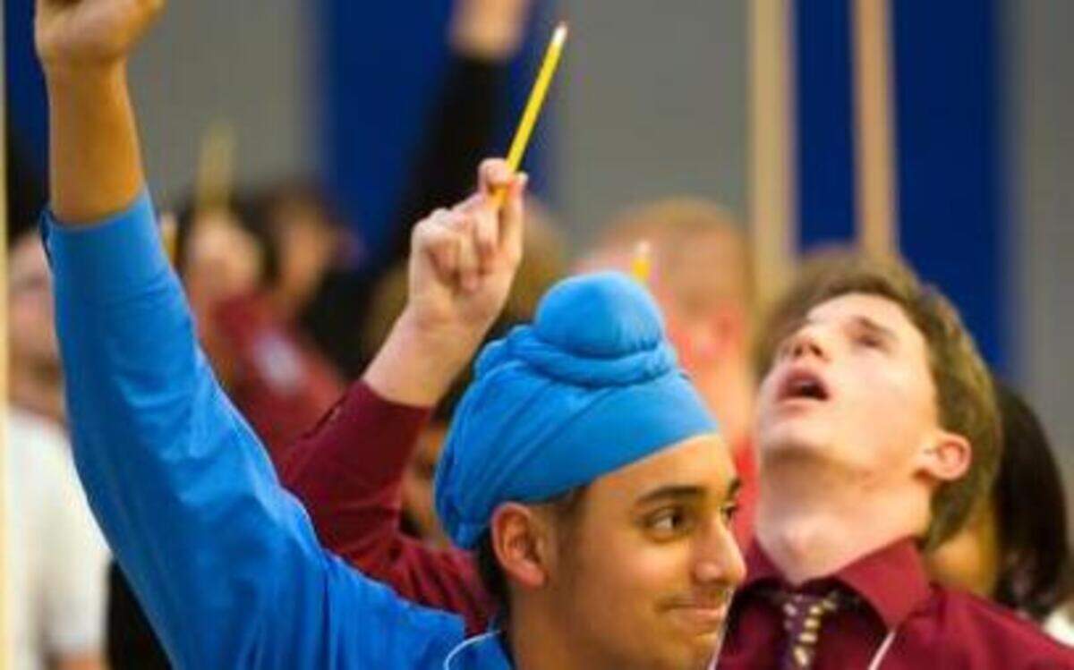 
Manpreet Dhaliwal of Pleasant Grove High School smiles after answering a question during the SuperQuiz showdown of the "Superbowl of Smarts" academic decathlon, held at Inderkum High School in 2011.
